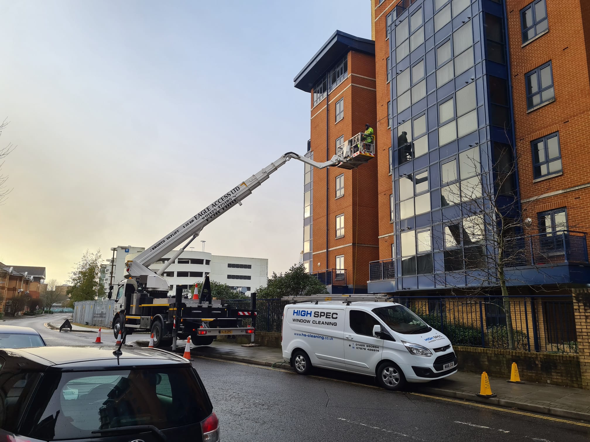 High rise window cleaning with crane